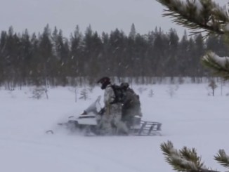 10th Special Forces Group Soldiers riding a snowmobile during Winter Warfare training. (Photo from video by SSG William Reinier, 10th SFGA, Oct 25, 2017).