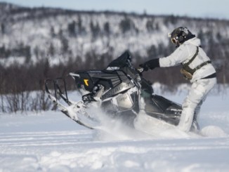 10th Special Forces member on a snow machine during a four week long winter warfare training exercise in Sweden. (photo by SSG Matthew Britton, SOCEUR, February 28, 20180.