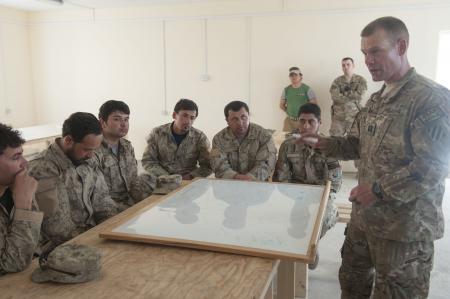 RAND SFA Paper - SFAAT Adviser from 4 BCT 3rd ID deployed in Logar province, Afghanistan provides instruction on C-IED to ANCOP (Photo by SGT Julieanne Morse, US Army).