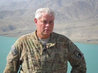 John Friberg at Sarobi Lake, Afghanistan while visiting a French brigade in July 2012 while serving as a Counterinsurgency Advisor assigned to the COMISAF Advisory and Assistance Team (CAAT).