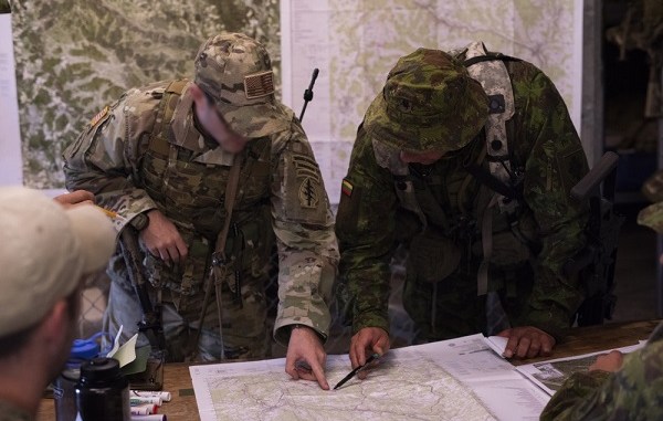Saber Junction 18 - KASP and 20th SFGA personnel conduct mission planning. Photo by 1st Lt Benjamin Haulenbeek; SOCEUR, Sep 19, 2018.
