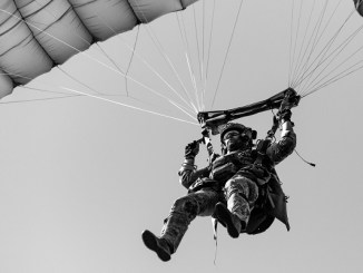 A U.S. Army Green Beret assigned to 19th Special Forces Group lands during a military freefall operation near Cincu, Romania while participating in Trojan Footprint 19. (SOCEUR, June 2019).