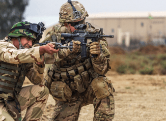 SFABs - Member of 82nd Abn Div trains an Iraqi soldier at Camp Taji, Iraq. (Credit U.S. Army/ SGT Cody Quinn)